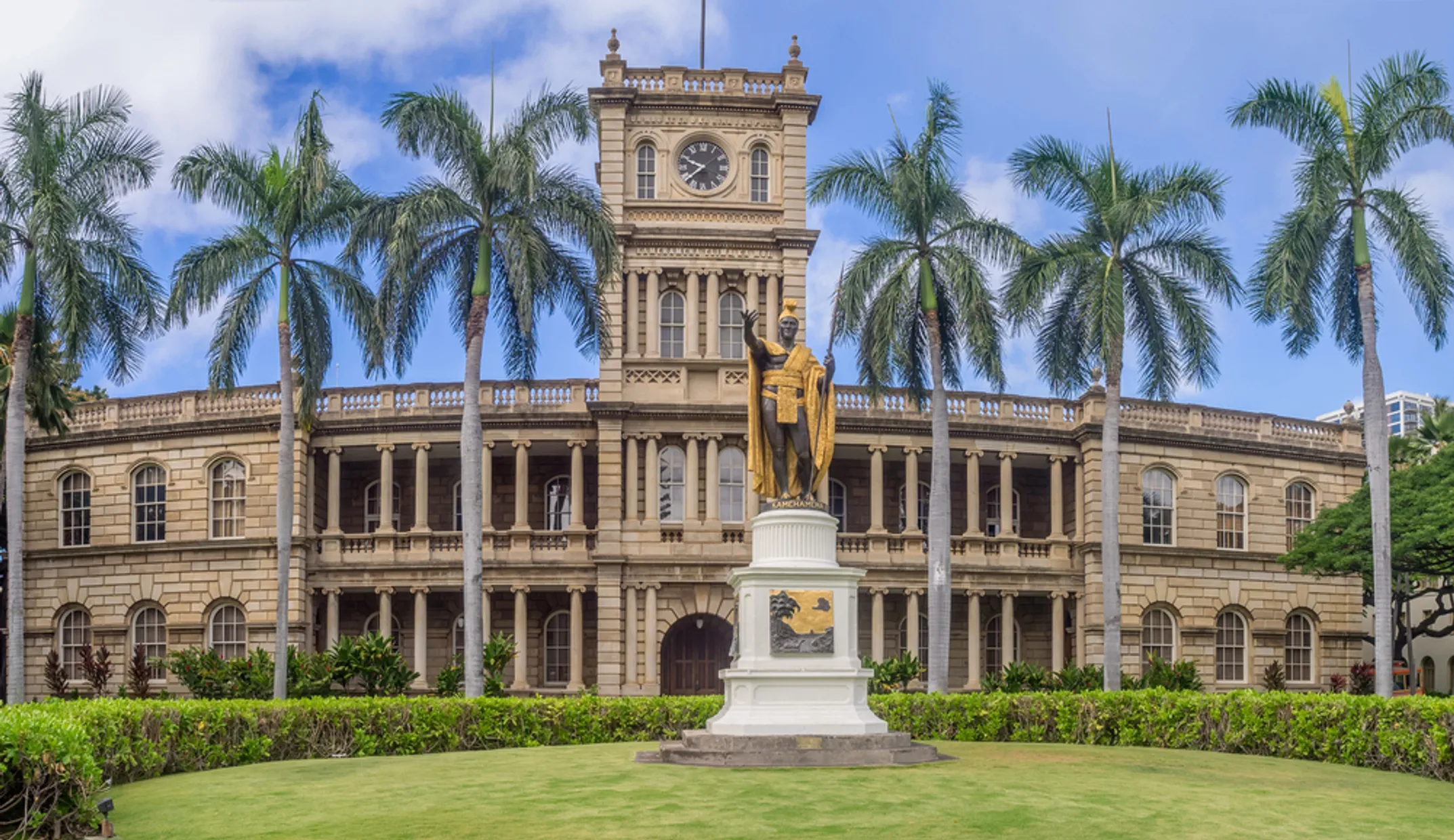 Painted Kamehameha statue showing vibrant community colors