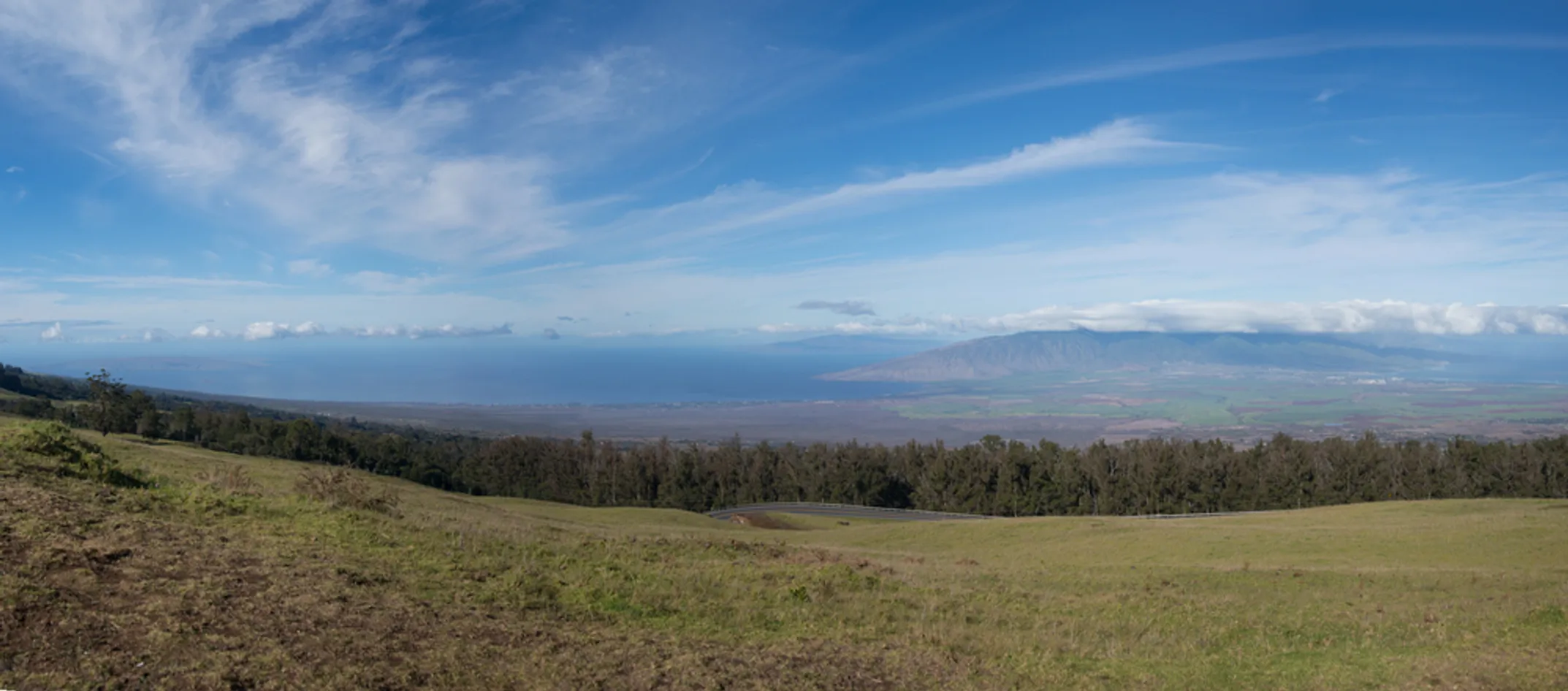Rolling hills of Upcountry Maui with Haleakalā volcano