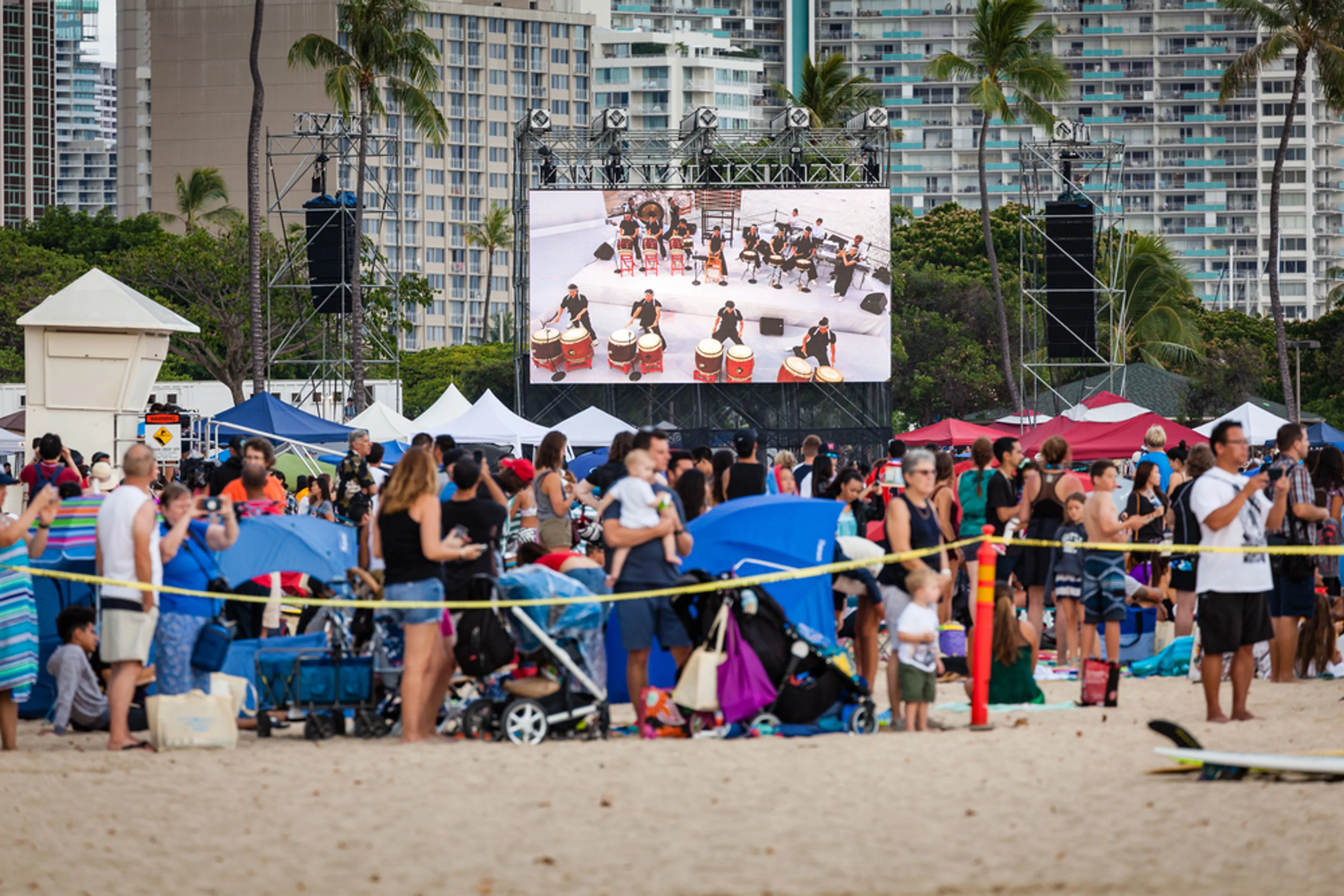 Maui festival with crowds gathered at outdoor venue with entertainment