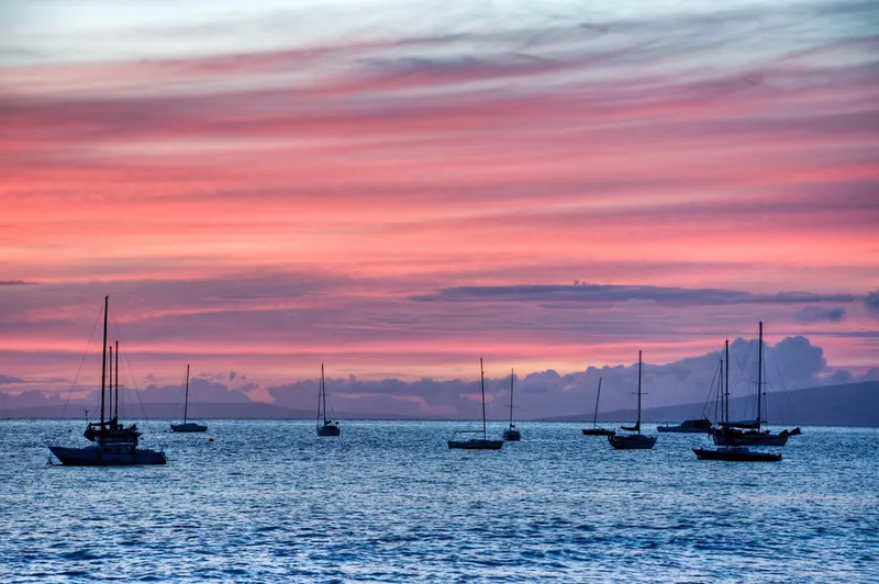 Lahaina harbor at sunset with West Maui Mountains