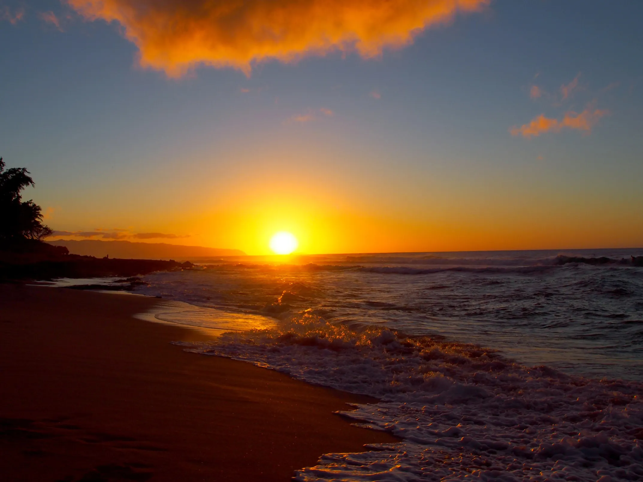 Hapuna Beach A-frame cabins at sunset with camping facilities overlooking the Pacific Ocean