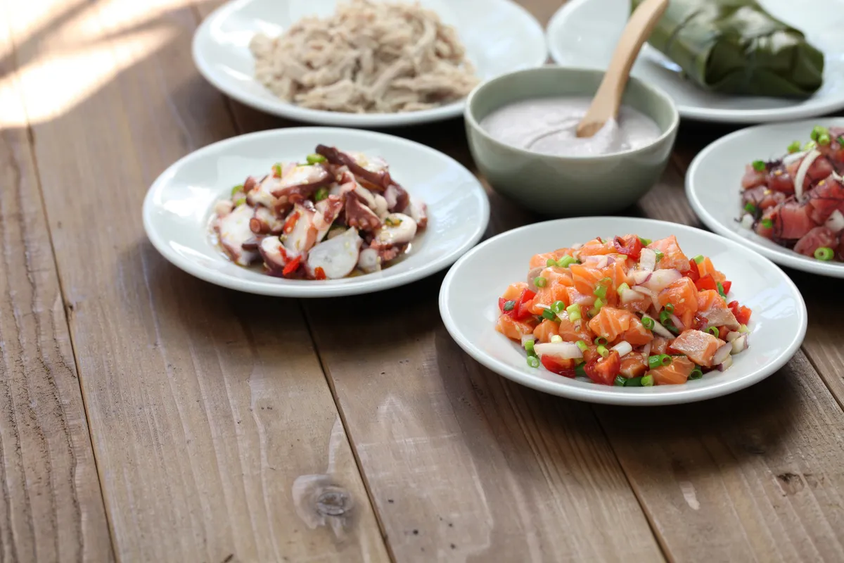 Traditional Hawaiian poke and local dishes spread
