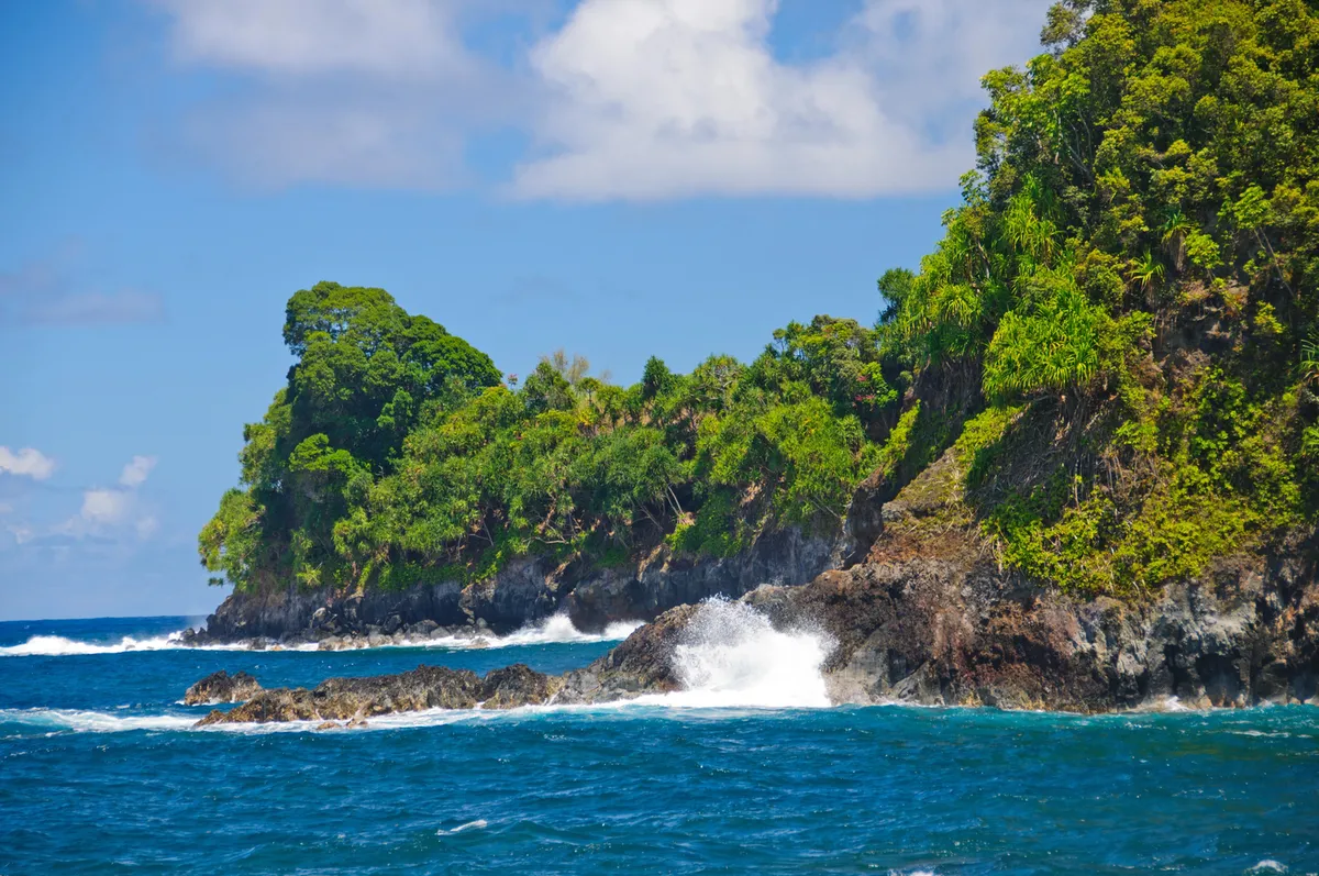 Morning magic at Leleiwi Beach Park with turquoise waters and volcanic coastline