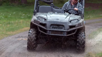 ATV rider navigating Hawaiian jungle trail