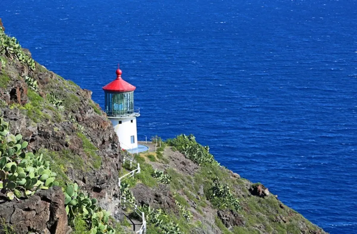 Makapu'u Point Lighthouse showcasing its distinctive red roof and white tower
