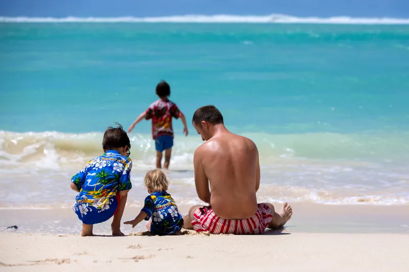 Families exploring diverse Oahu attractions - Pearl Harbor, snorkeling tours, adventure parks, and cultural experiences