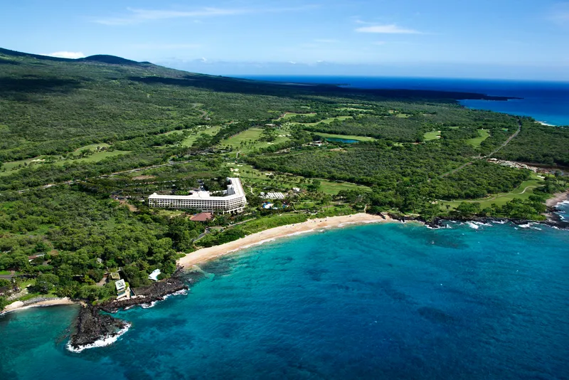 Award ceremony or trophy display showcasing top-rated Big Island resorts with ranking medals and luxury amenities