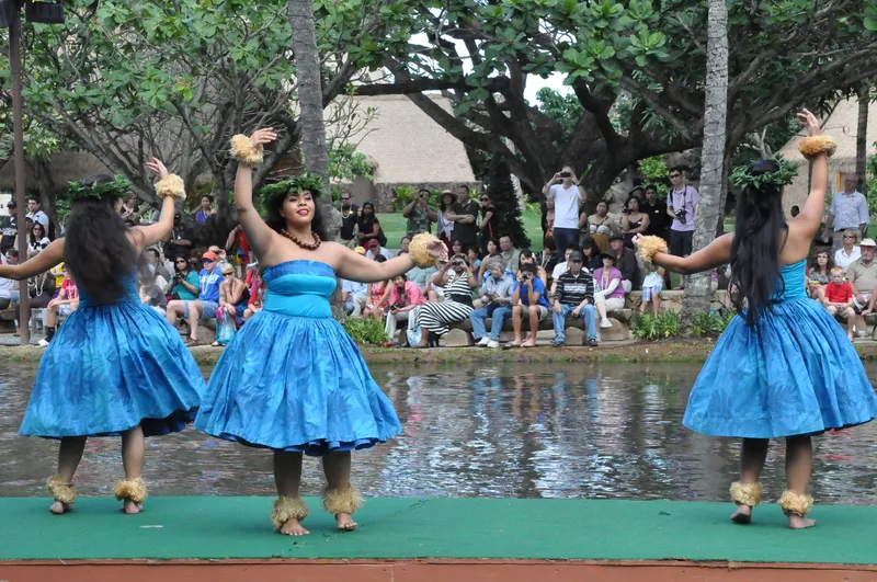 Traditional hula kahiko dancers in ancient Hawaiian dress