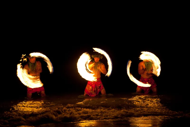 First-time Hawaiian luau visitors experiencing traditional activities and cultural hospitality