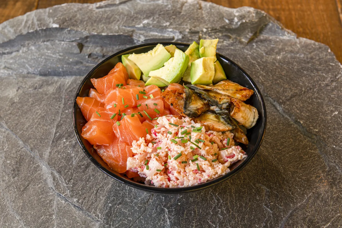 Fresh poke bowl with salmon, avocado, and local ingredients representing modern Hawaiian dining experience