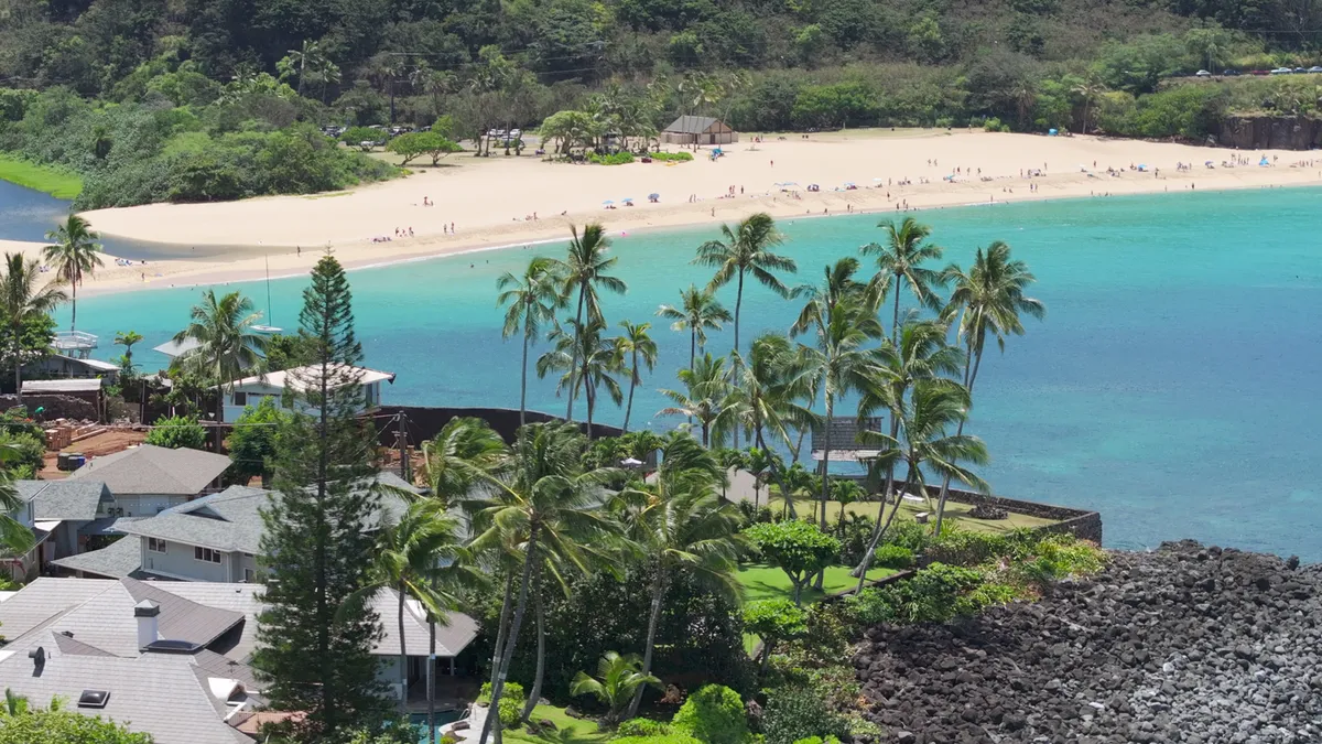 Stunning aerial view of North Shore beach with palm trees, Oahu Hawaii